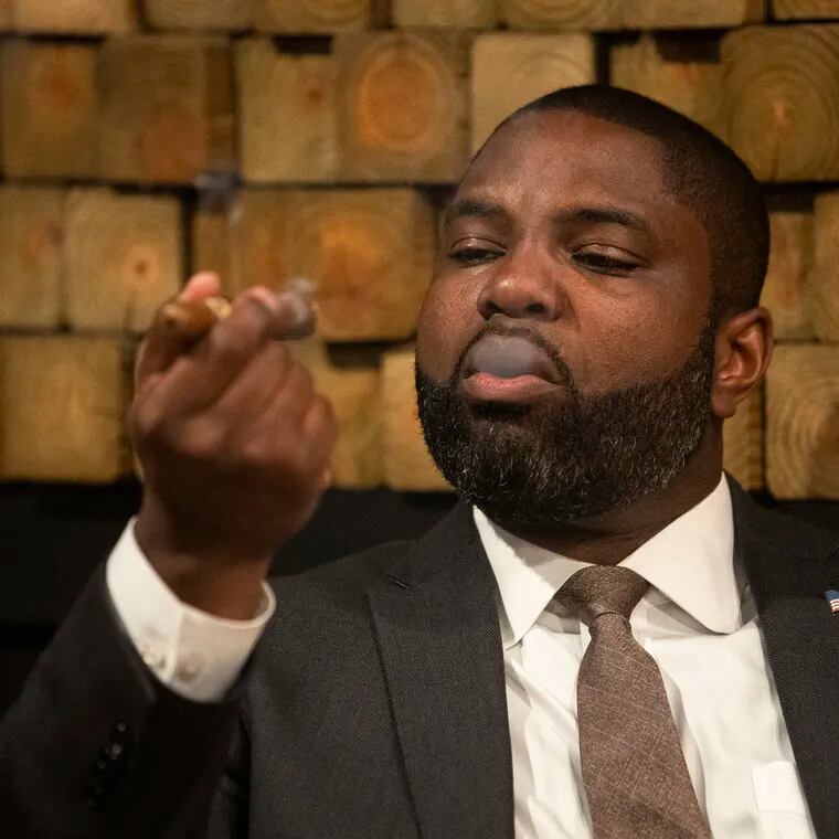 Congressman Byron Donalds smokes a cigar during Congress, Cognac and Cigars at The Cigar Code in Philadelphia on Tuesday, June 4, 2024.