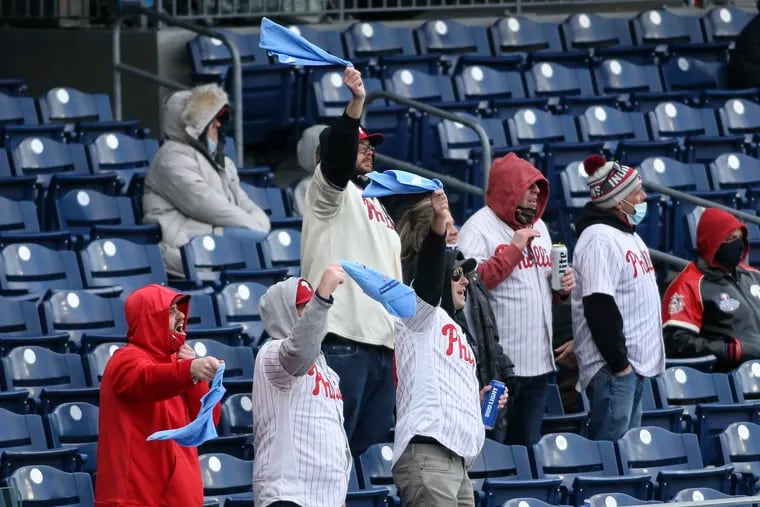 Phillies fans cheer against the Braves during opening day at Citizens Bank Park in Philadelphia. The Phillies beat the Braves, 3-2, in 10 innings.