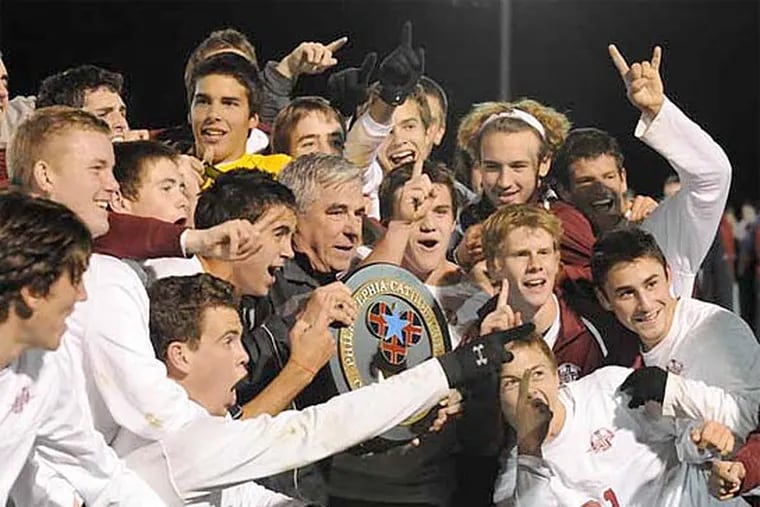 St. Joseph's Prep soccer coach Jim Murray and the Hawks celebrate their Catholic League championship in 2010.