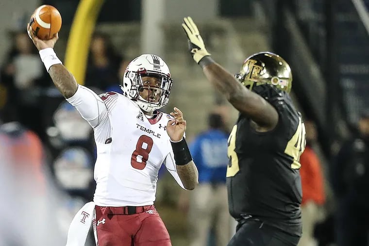 Temple's quarterback Phillip Walker throws a pass around Wake Forest's Willie Yarbary.