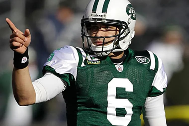 Quarterback Mark Sanchez and the Jets will look to pick up their first win against the Eagles on Sunday. (Kathy Willens/AP Photo)