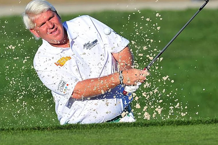 John Daly hits from a sand trap on the twelfth course during the second round at Monterey Peninsula Country Club. (Gary A. Vasquez/USA Today)