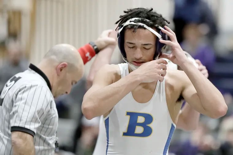 Buena H.S. wrestler Andrew Johnson walks off the mat after losing during a wrestling match at Timber Creek High school in January.