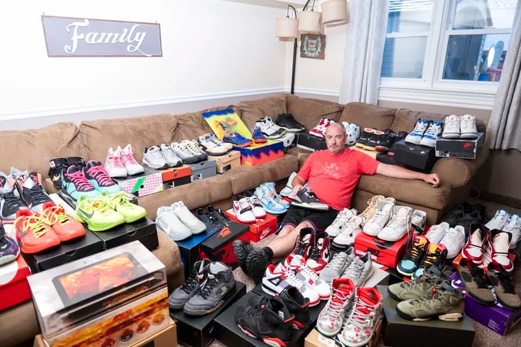 Mike “Meech Milici sits among his sneaker collection in his home in Northeast Philadelphia. He has been collecting sneakers since 2009 and currently has about 100 pairs.