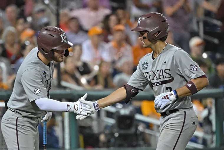 Kaeden Kent #3 of the Texas A&M Aggies celebrates Gavin Grahovac #9 after hitting a two run home run in the seventh inning against the Tennessee Volunteers during the NCAA Division I Baseball Championship on June 22, 2024 at Charles Schwab Field in Omaha, Nebraska. (Photo by Peter Aiken/Getty Images)