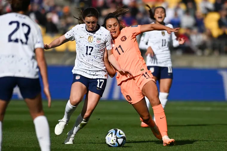 Andi Sullivan (center) dueling with the Netherlands' Lieke Martens.