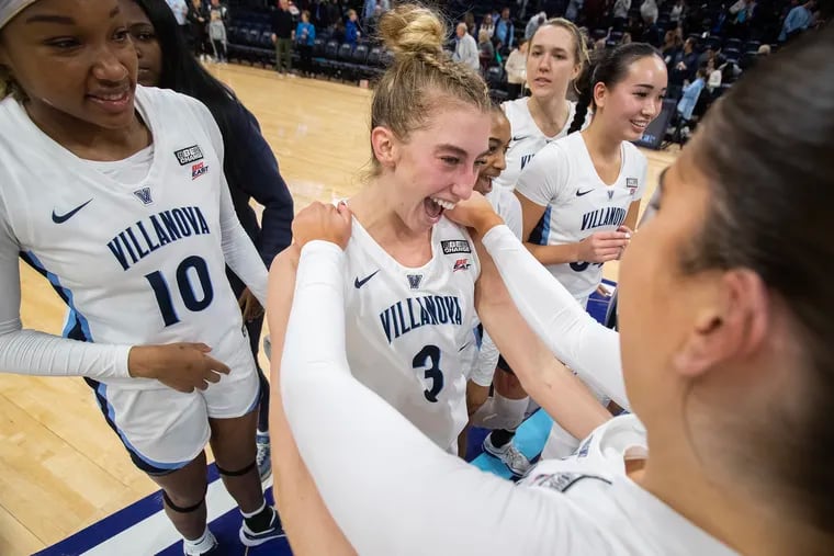 Lucy Olsen (center) is Villanova's go-to scoring option and recently crossed the 1,000-point threshold for her career. But for the junior, basketball is just plain fun.