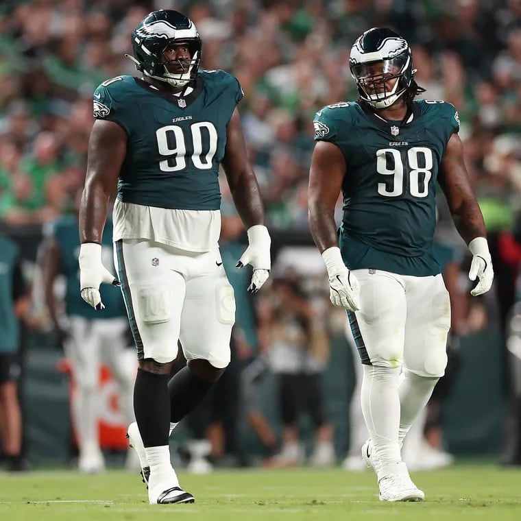 Eagles defensive tackle Jordan Davis (left) and fellow defensive tackle Jalen Carter (right) walk onto the field together as the Philadelphia Eagles play the Atlanta Falcons at Lincoln Financial Field in Philadelphia, Monday, Sept. 16, 2024.