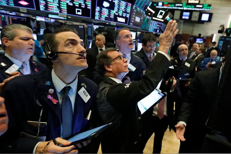 Traders gather at a post on the floor of the New York Stock Exchange, Wednesday, March 4, 2020. Stocks are surging in early trading on Wall Street, led by health care stocks after Joe Biden scored a number of Super Tuesday wins.