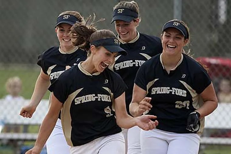 Spring-Ford’s Alexis Karkoska (No. 9), whose leadoff double sparked the rally, and teammates celebrate their victory. (Ed Hille/Staff Photographer)