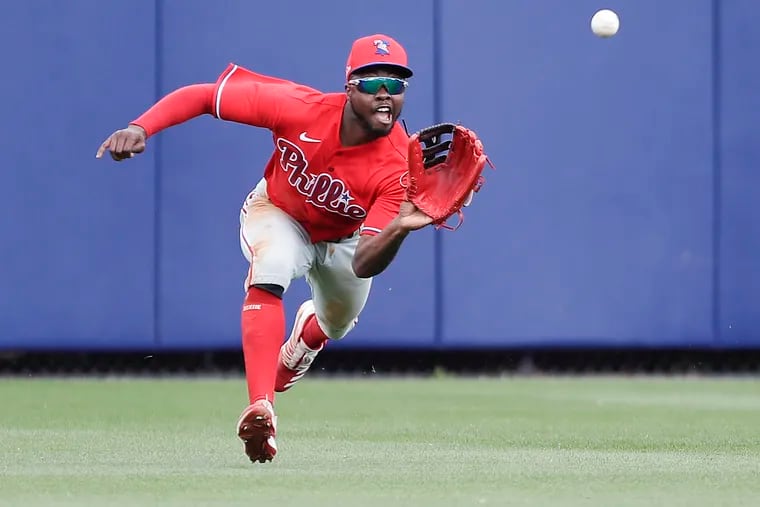 Phillies Roman Quinn charges to catch Rays Mike Zunino's line drive.