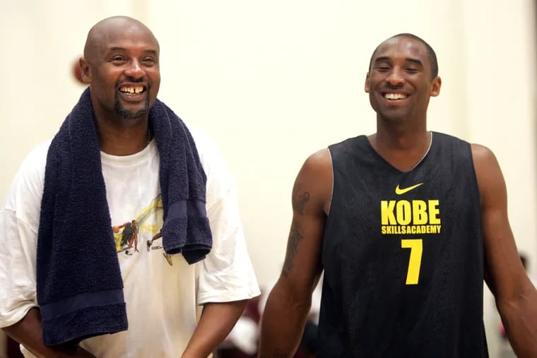 Joe Jellybean Bryant, shares a laugh with his son Kobe in a pickup basketball game at the Kobe Bryant Basketball Academy on Thursday, July 5, 2007. Joe Bryant died this month from a massive stroke.