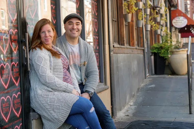 Heather Annechiarico and Chris Fetfatzes outside Wine Dive at 1506 South St., next to their bar-restaurant The Cambridge.