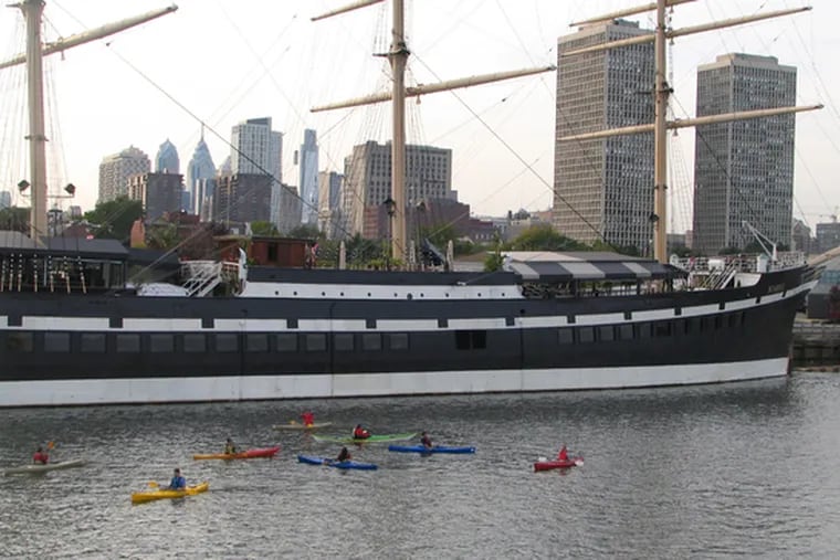 Kayakers dabble in the Delaware along the Moshulu, moored at Penn&#0039;s Landing. The Pennsylvania Environmental Council and others are promoting the lower Delaware for its recreational value.