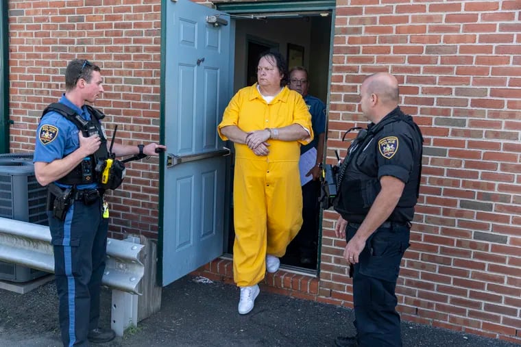 Robert Atkins being escorted out from Bucks County District Court in Bristol, Pa., Wednesday, Sept., 21, 2022. Atkins faced a judge for the murder of Joyce Hibbs.