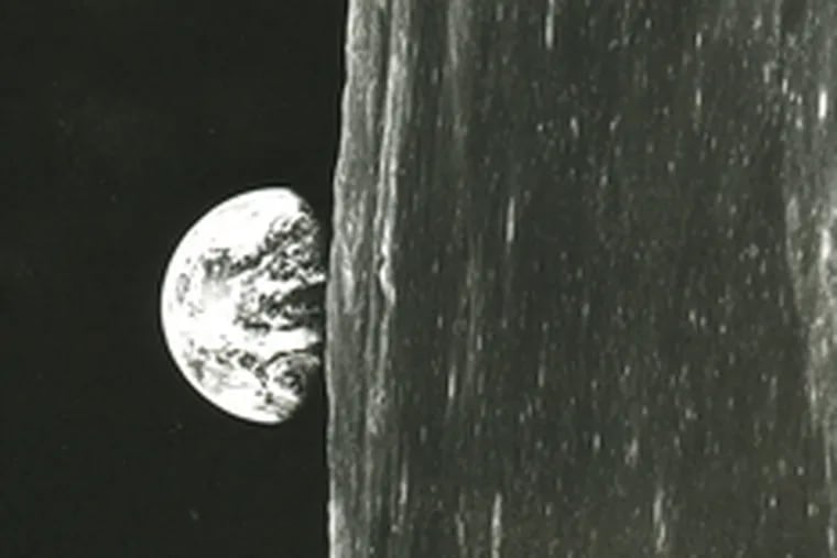 Earth rising , as seen from outer space. This is an image that was first seen by human eyes during the Christmas season 40 years ago, when U.S. astronauts orbited the moon.
