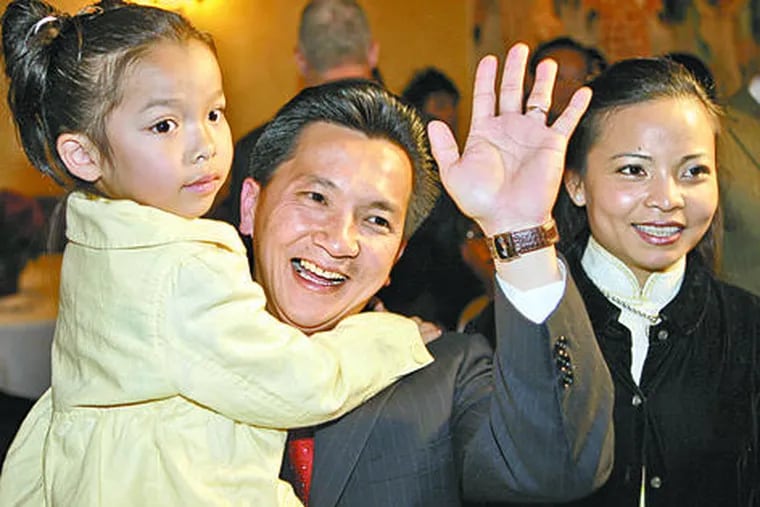 Republican Anh &quot;Joseph&quot; Cao, daughter Betsy, and wife, Kate Hieu Hoang, after he defeated Rep. William Jefferson (D., La.). Anh will be the first Vietnamese American in Congress.