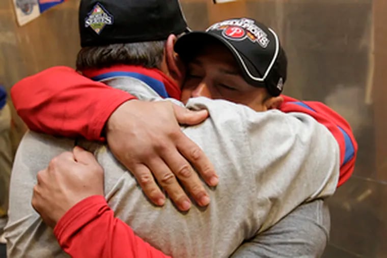 Philadelphia Phillies catcher Carlos Ruiz hugs Phillies closer Brad Lidge  after defeating the Tampa Bay Rays to win the World Series in Philadelphia