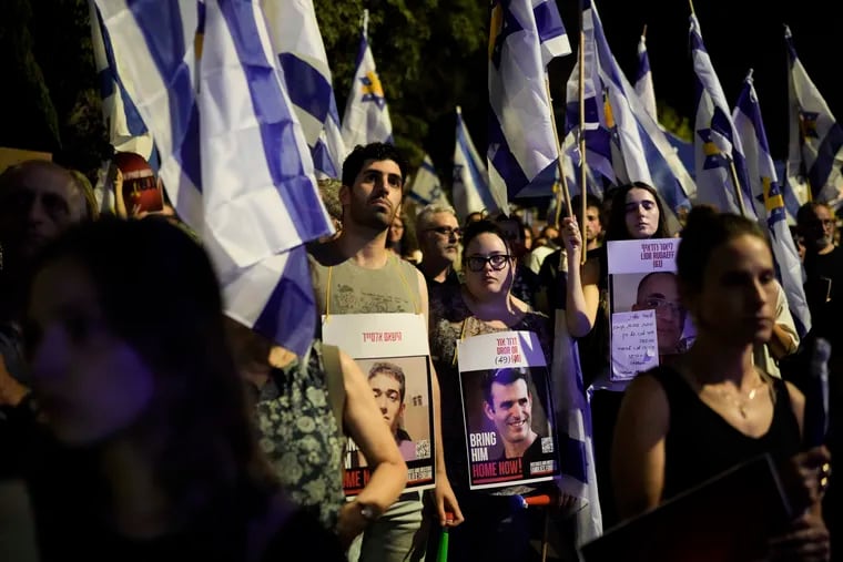 People attend a rally demanding a cease-fire deal and the immediate release of hostages held by Hamas in the Gaza Strip after the deaths of six hostages in the Palestinian territory, in Jerusalem on Monday.