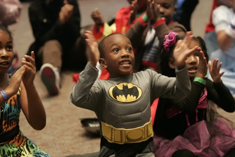 In this file photo, a 6-year-old Batman celebrates Halloween.