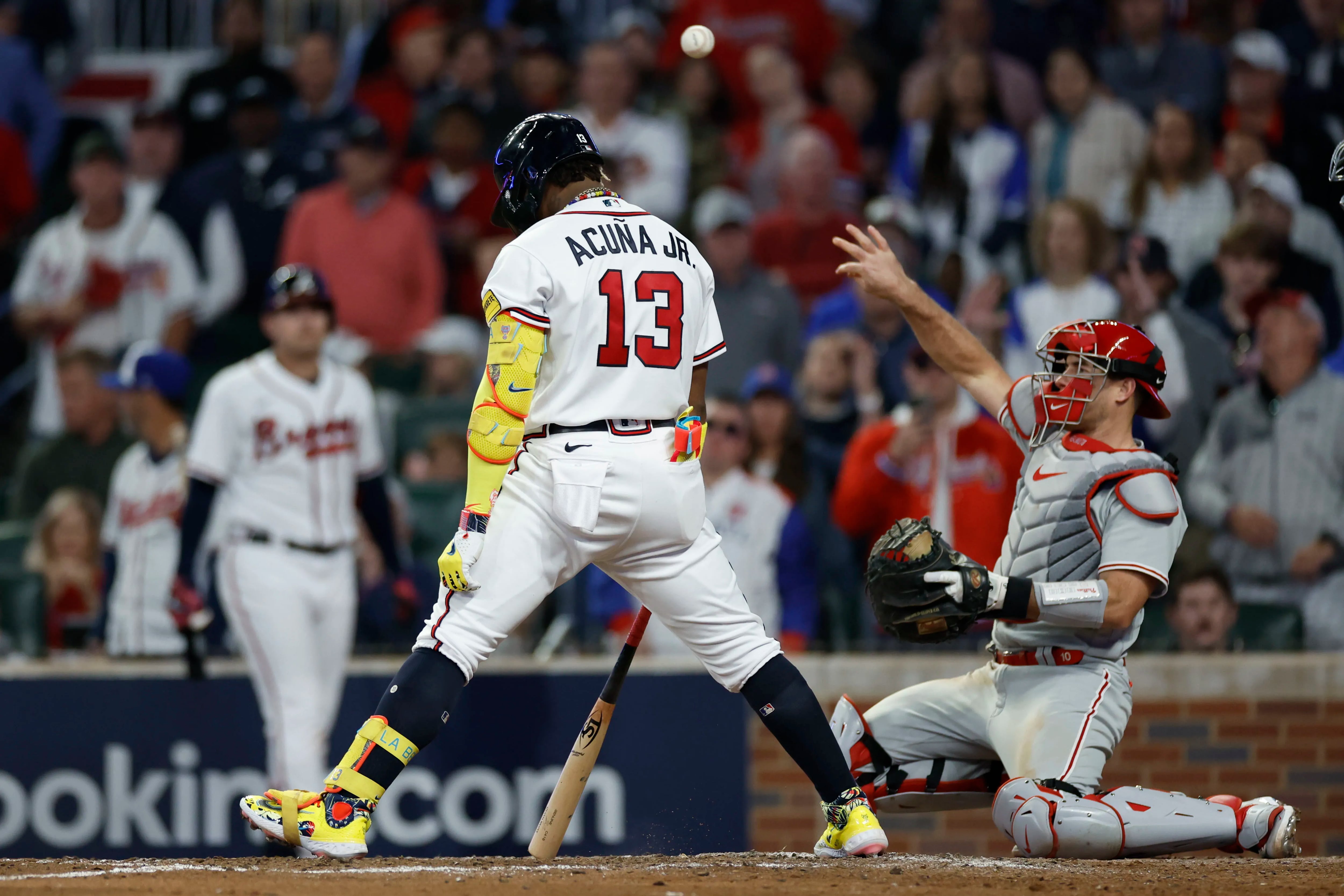 Braves fans throw cans on field after catcher interference call