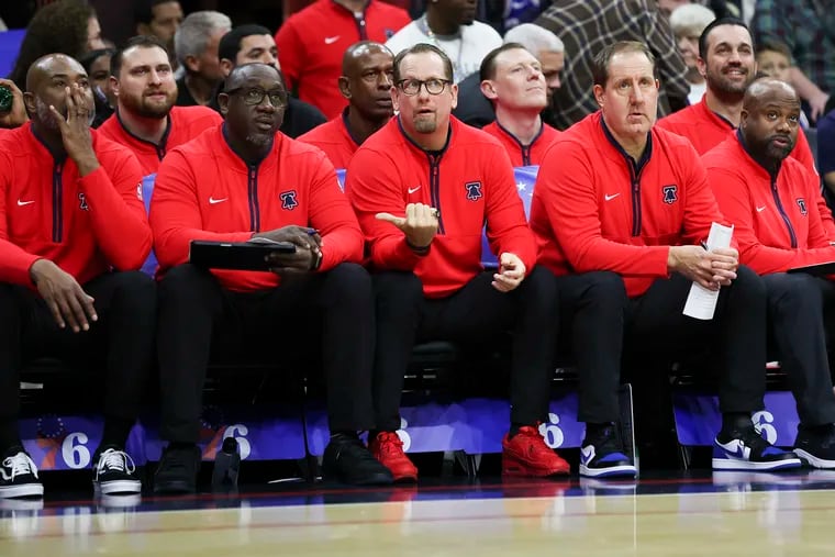 Bryan Gates (second from the right) next to longtime friend and Sixers head coach Nick Nurse.