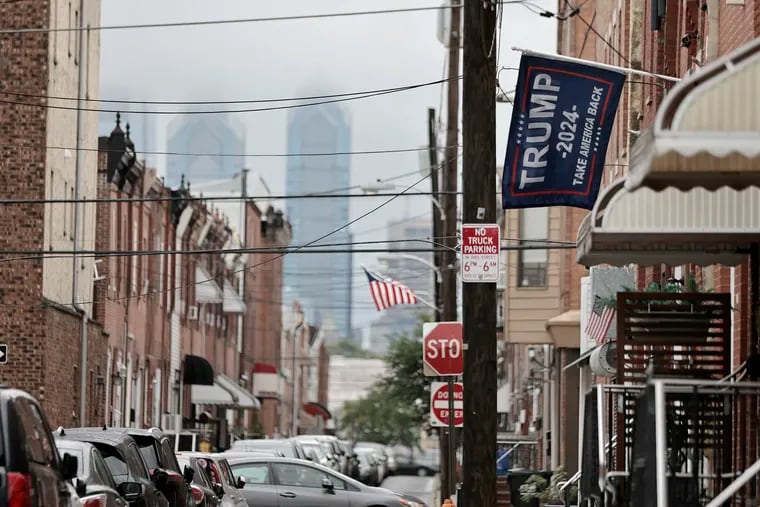 A Trump 2024 flag hangs in front of a rowhouse on South Mole Street in South Philadelphia.