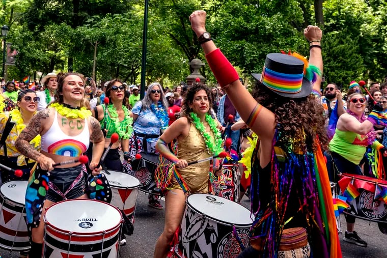 Drummers from Batala Philly, an all-percussion, community band that plays samba reggae music from Brazil, warm up the crowd before the march up Walnut Street at 2023's Philadelphia Pride March.