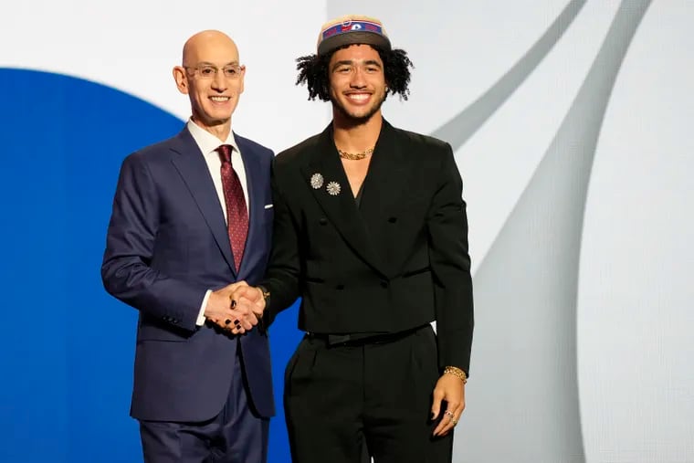 Jared McCain poses for a photo with NBA commissioner Adam Silver after being selected 16th by the Philadelphia 76ers during the first round of the NBA basketball draft, Wednesday, June 26, 2024, in New York.