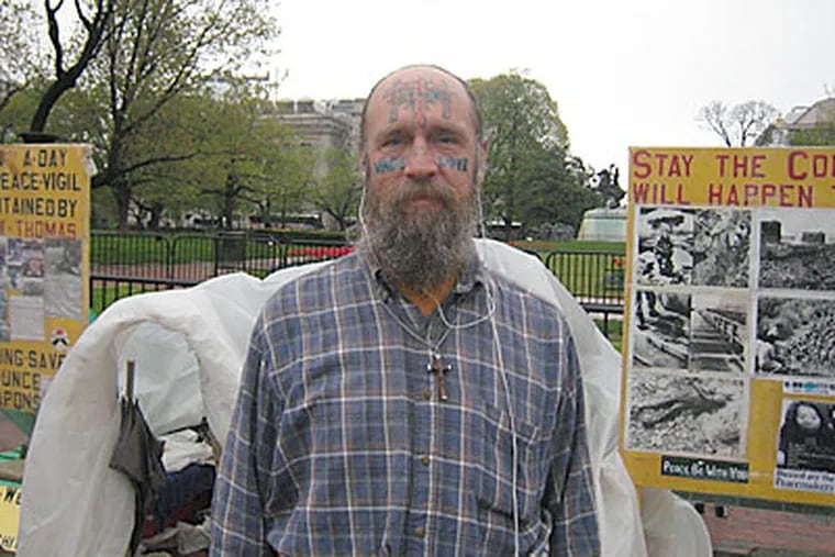 Jay McGinley spends 24 hours a day in front of the White House as a full time protester. He protests against nuclear weapons and conventional energy. (Konstanze Walther / Staff Photographer)