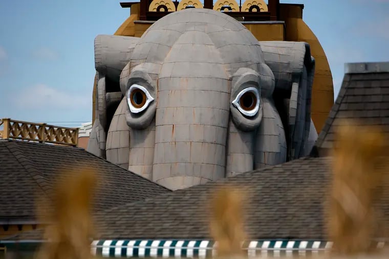 Lucy appears to peer out between two buildings near the beach in Margate, New Jersey on May 10, 2009. Lucy is receiving a new paint job before the 2009 summer season.