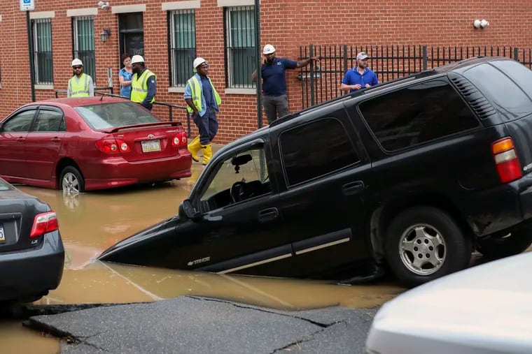 A water main break at Hewson Street and North Fourth Street in Philadelphia on Thursday caused the road to buckle and flooded the street for hours.