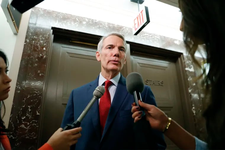 FILE - In this Sept. 18, 2018 file photo, Sen. Rob Portman, R-Ohio, stops to answer questions for members of the media as he returns to a hearing on Capitol Hill in Washington. Portman suggests that the U.S. require the Defense Department, not Commerce, to determine what imports threaten national security.