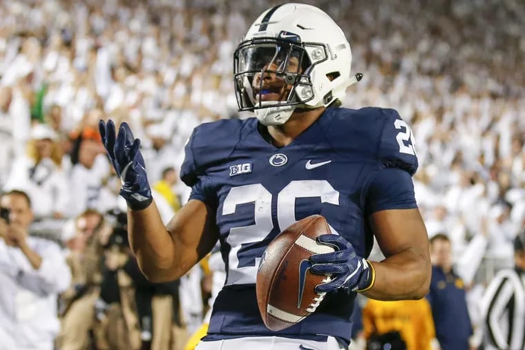 Penn State running back Saquon Barkley reacts after scoring a touchdown against Michigan on Saturday.