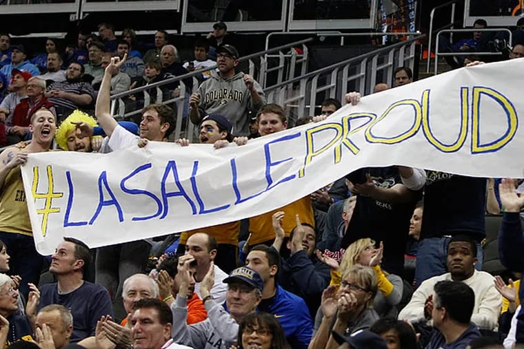 La Salle fans in Kansas City celebrate the Explorers' win over Mississippi. (Ron Cortes/Staff Photographer)