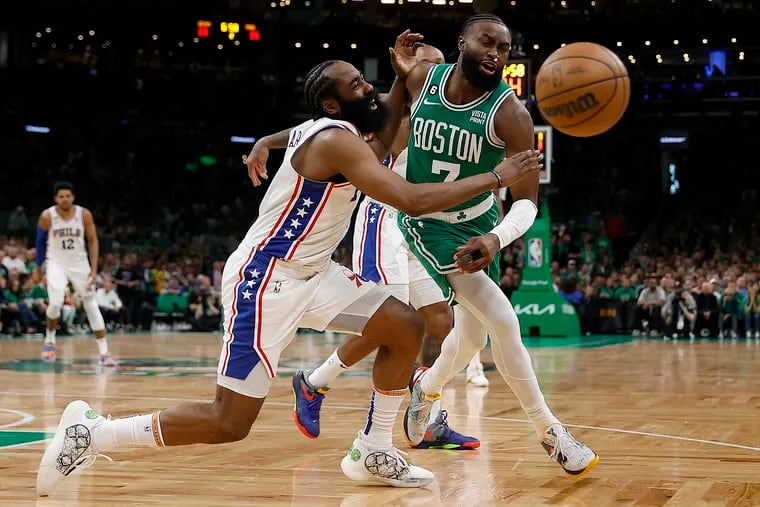 James Harden (left) and Boston Celtics guard Jaylen Brown battle for the ball in Game 7 of the NBA Eastern Conference semifinals on May 14. Brown recovered the ball.