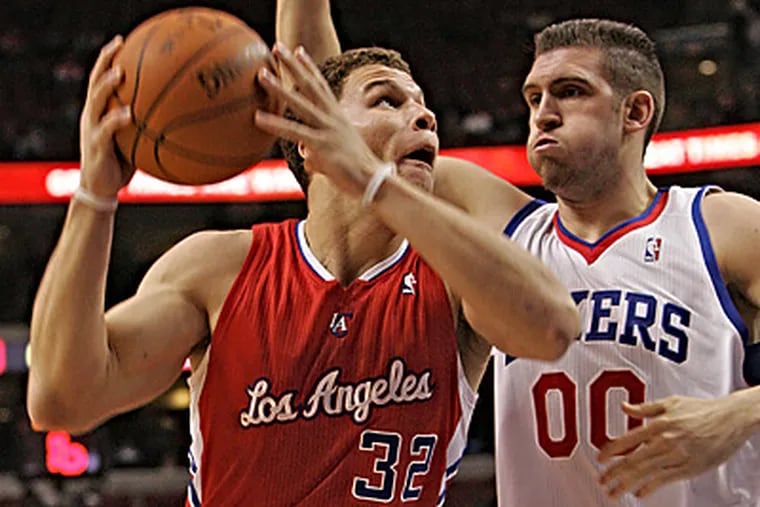 Clippers' Blake Griffin goes up for a basket against Spencer Hawes. (David M Warren / Staff Photographer)