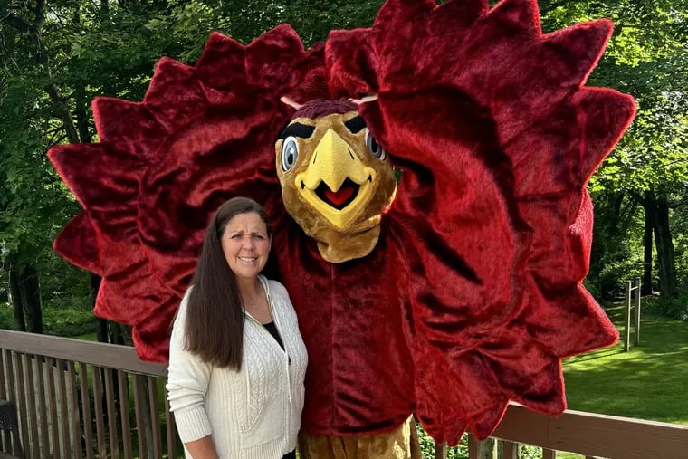 New St. Joseph's Hawk mascot David Moser with his mother, Barbara, who was a Hawk in the early 1990s.