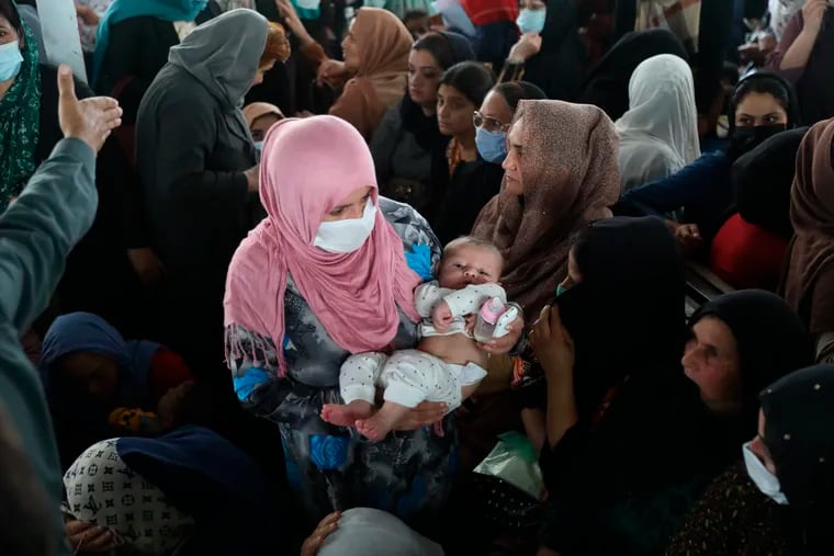 Women wait inside the passport office in Kabul, Afghanistan, on Wednesday, June 30, 2021. Afghans lined up by the thousands at the Afghan passport office to get new passports ahead of the U.S. departure from Afghanistan.