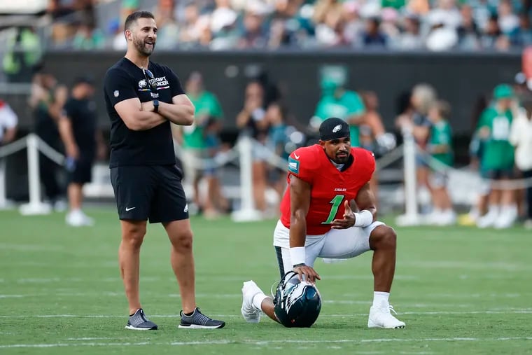 Eagles quarterback Jalen Hurts with head coach Nick Sirianni during a public practice at Lincoln Financial Field on Aug. 1. “Jalen and I are in a really good place,” Sirianni said Thursday.