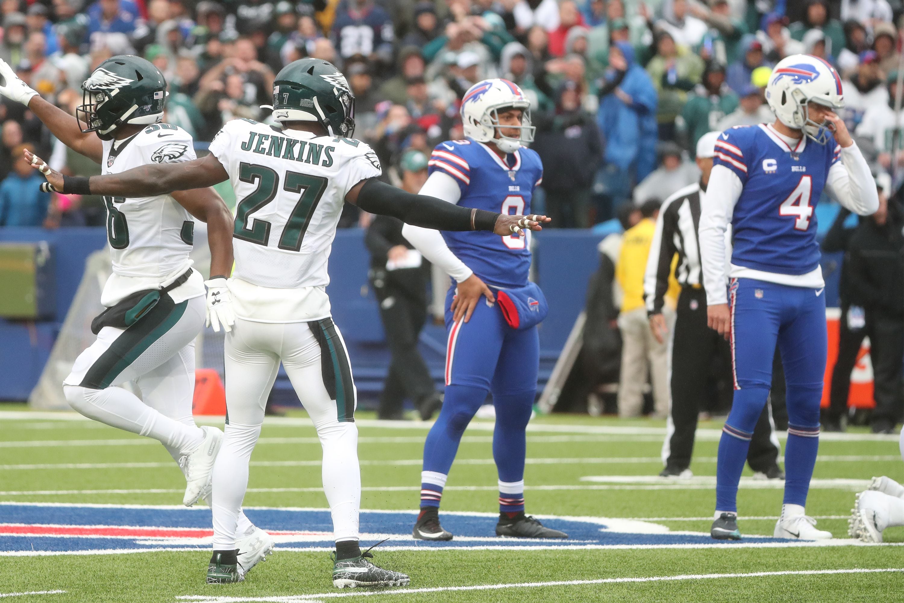 Philadelphia Eagles' Dallas Goedert, left, catches a pass in front of  Buffalo Bills' Jordan Poyer during the first half of an NFL football game,  Sunday, Oct. 27, 2019, in Orchard Park, N.Y. (