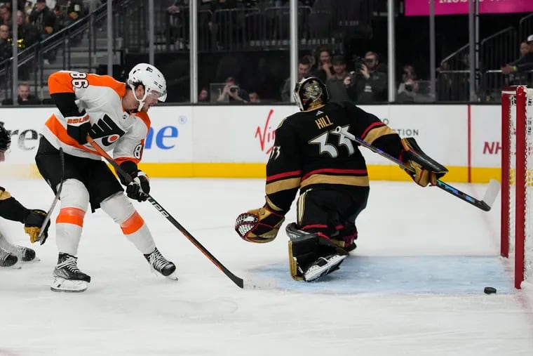 Flyers left wing Joel Farabee (86) tries to shoot the puck past Vegas Golden Knights goaltender Adin Hill during the third period.