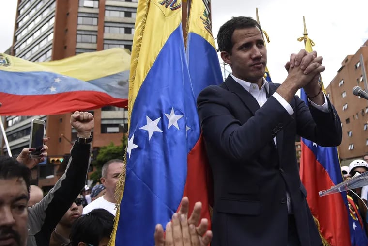 Juan Guaido gestures to a crowd in Caracas, Venezuela, on Wednesday, Jan. 23, 2019.