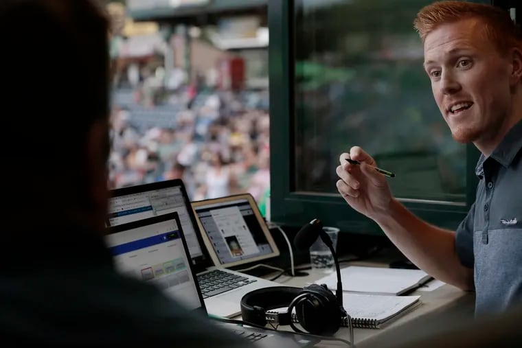 Tommy McCarthy chats with fellow broadcaster Mike Warren (left) during a Trenton Thunder game on July 25.