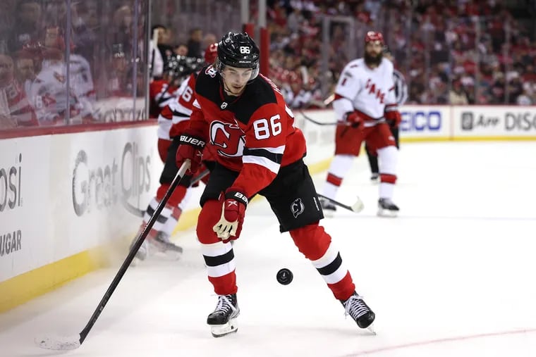 New Jersey Devils center Jack Hughes scored twice in his team’s 8-4 playoff victory over the Carolina Hurricanes on Sunday. The Devils and Hurricanes have combined for 25 goals through the first three games of their best-of-7 playoff series, which resumes Tuesday in New Jersey. (Photo by Elsa/Getty Images)