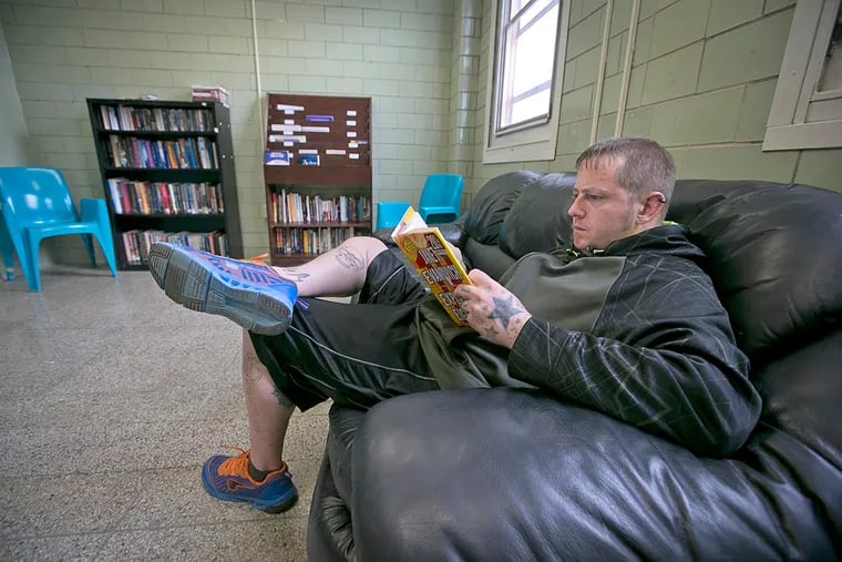 Jeremy Gordon, of Berks County and a resident at Wernersville Community Corrections Center, reads in the quiet room.