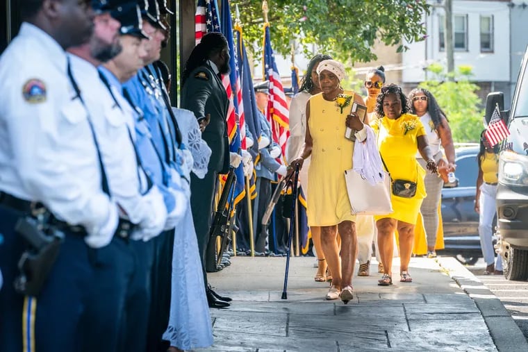 Mourners arrive for the viewing and funeral service for Philadelphia Police Officer Lynneice Hill, who died July 15 from a medical emergency, at the Mt Airy Church of God in Christ, in Philadelphia, Wednesday, July 26, 2023.