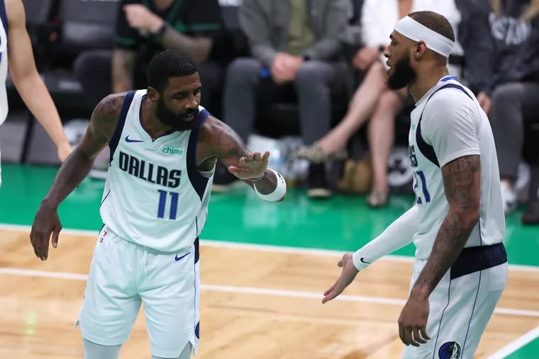 Kyrie Irving #11 and Daniel Gafford #21 of the Dallas Mavericks high five during the fourth quarter against the Boston Celtics in Game Two of the 2024 NBA Finals at TD Garden on June 09, 2024 in Boston, Massachusetts. (Photo by Adam Glanzman/Getty Images)