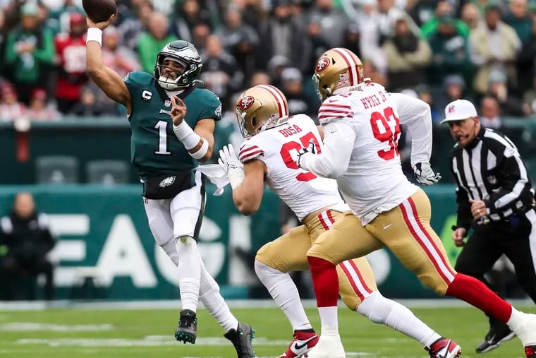 Philadelphia Eagles quarterback Jalen Hurts scrambles and throws an incomplete pass during the first quarter of the NFC Championship game against the San Francisco 49ers at Lincoln Financial Field on Sunday, Jan. 29, 2023, in Philadelphia. The Philadelphia Eagles defeated the San Francisco 49ers 31 to 7.