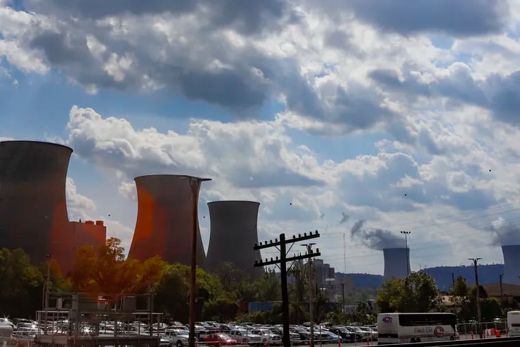 The Bruce Mansfield power plant, left, in Shippingport, Pa., is seen from across the Ohio River from Industry, Pa. on Thursday, Oct. 3, 2019. Owners of coal-fired power plants, like the Bruce Mansfield plant that closed in November 2018, could pay more to emit carbon dioxide under a Governor Wolf-backed plan to join a consortium that prices and limits carbon dioxide emissions to help fight climate change.